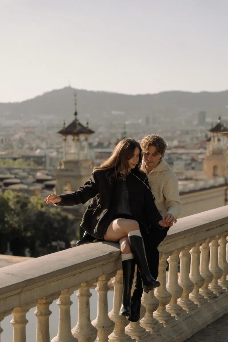 A couple shares a peaceful moment on a sunlit terrace in Barcelona during a couples & engagements photoshoot.