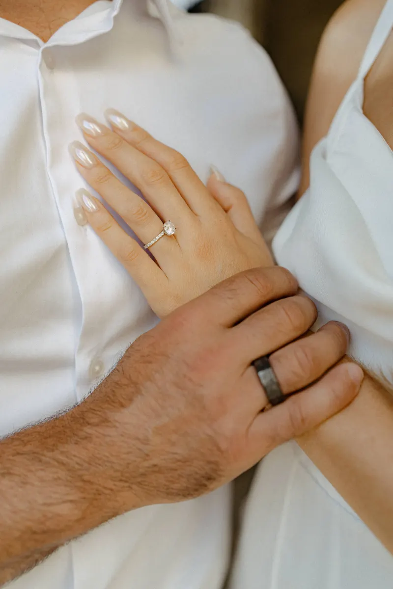 Close-up of a couple’s hands showing their engagement rings, captured during a couples & engagements photoshoot.