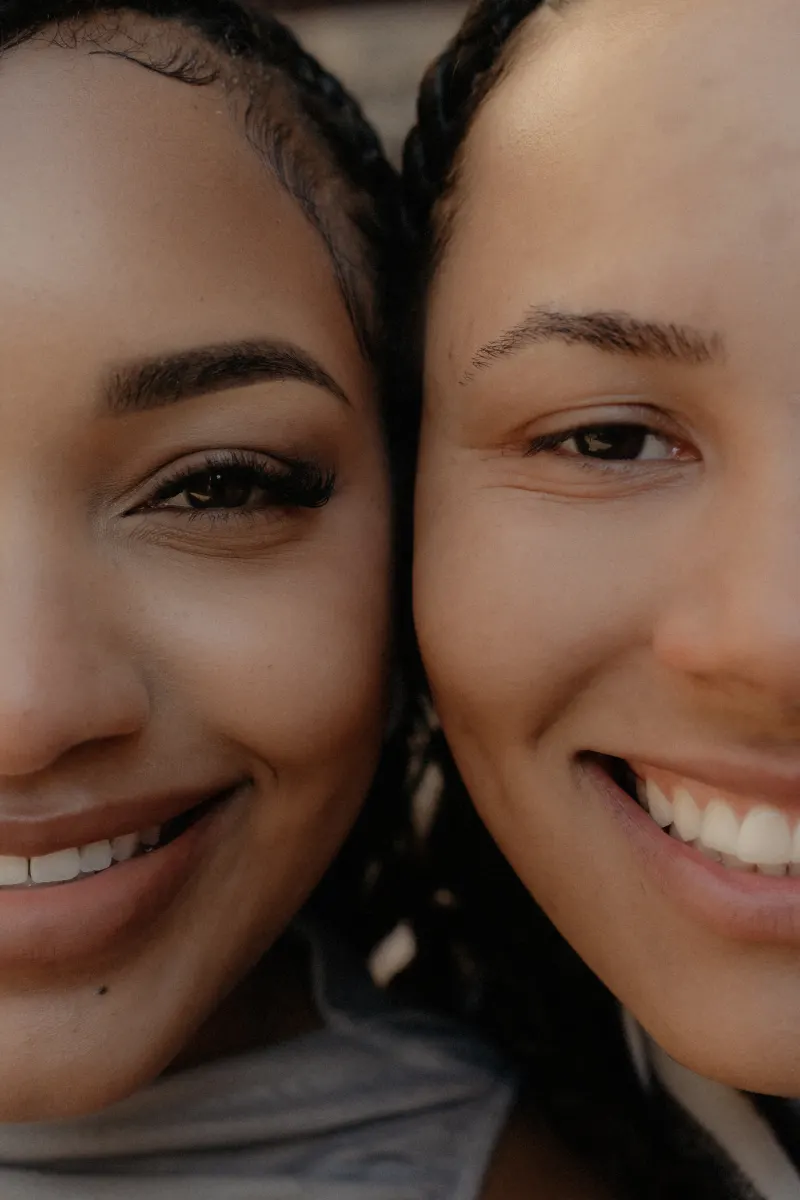 Close-up of two smiling partners, radiating joy and connection during their surprise proposal photoshoot in Barcelona.
