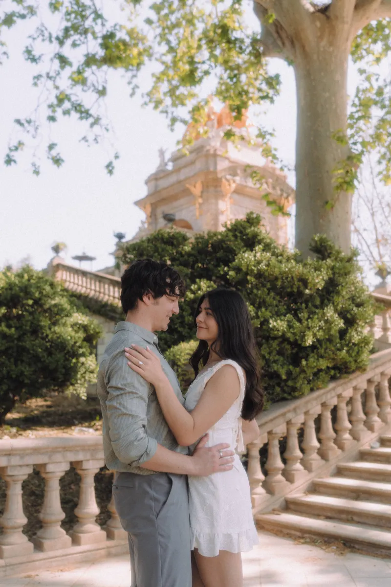 Couple gazing into each other’s eyes, sharing a quiet embrace during an engagement photoshoot at Parc de la Ciutadella.