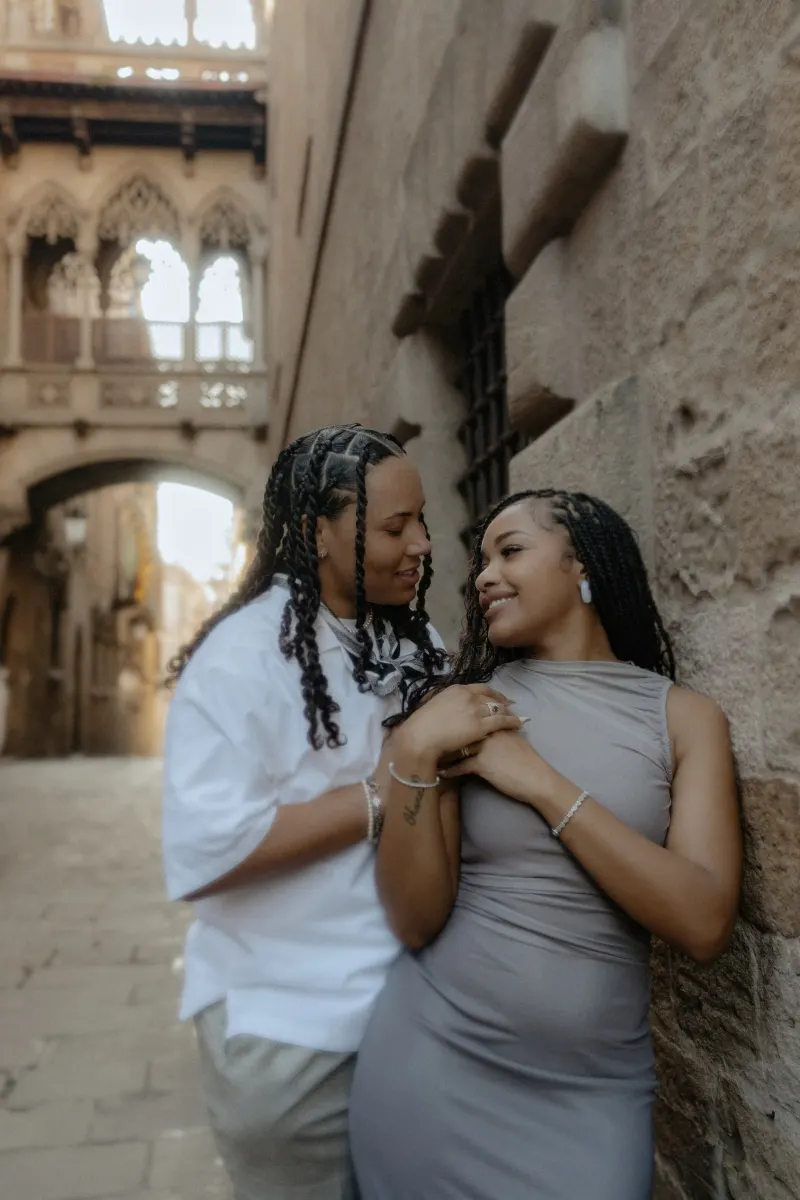 Couple shares a loving, candid moment in Barcelona’s Gothic Quarter during a surprise proposal photoshoot.