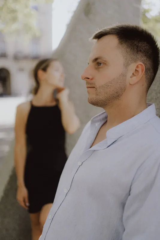 Couple shares a quiet, thoughtful moment outdoors during a couples & engagements photoshoot session.