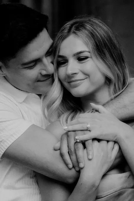 Couple sharing a tender embrace, smiling softly during their Vacation Portraits session in Barcelona.