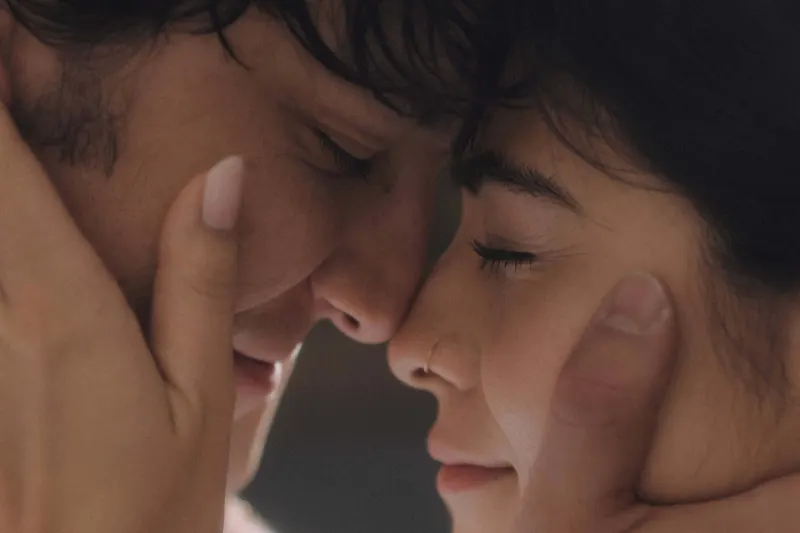 Couple with eyes closed sharing a gentle, intimate forehead touch during a couples & engagements photoshoot.