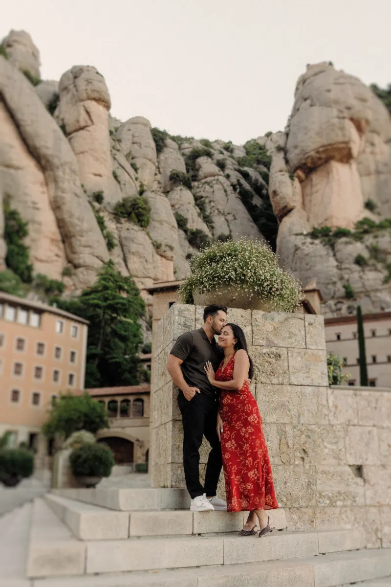 Dan and Sydney share a final romantic portrait among the stone architecture of Montserrat.
