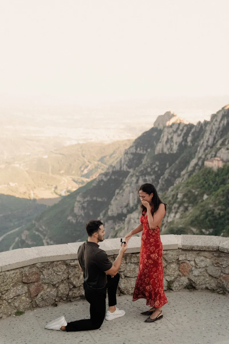 Dan holds the engagement ring while Sydney takes in the surprise proposal in Montserrat.