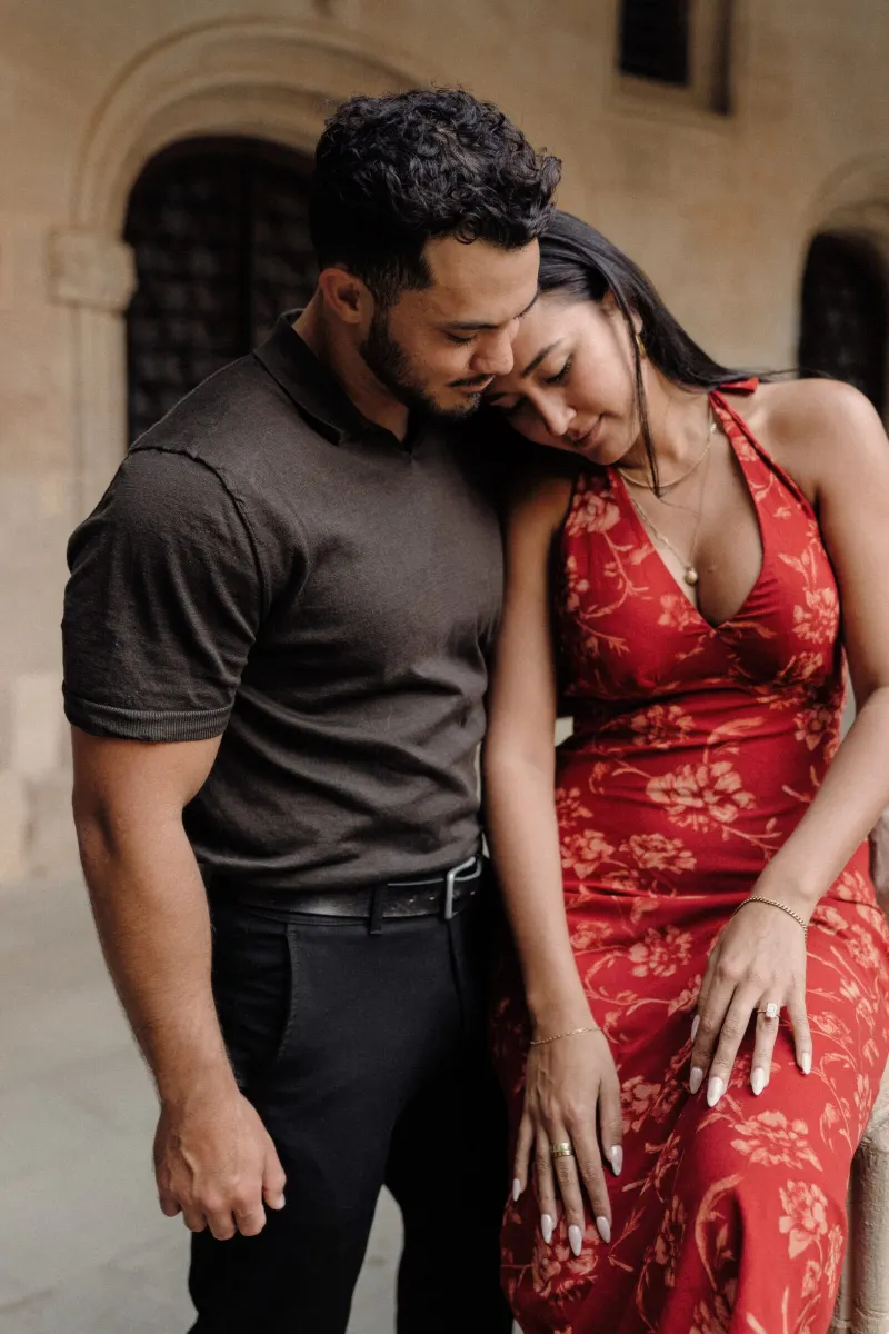 Dan leans close to Sydney during an intimate seated portrait in the Montserrat cloister.