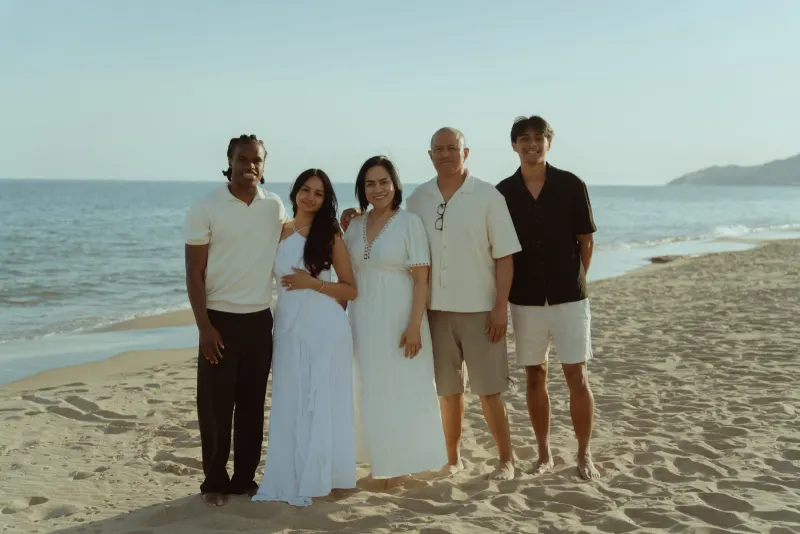 Dexter and Cheryl celebrate their engagement with family on Castelldefels Beach.