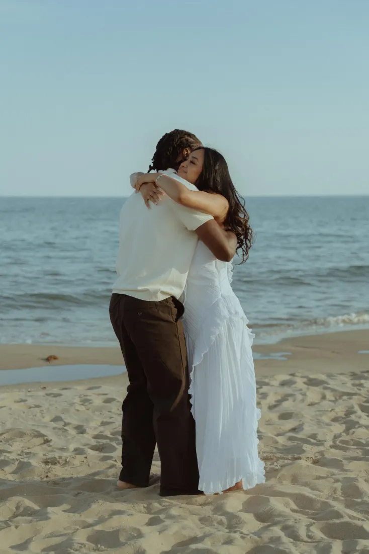Dexter and Cheryl embrace after their surprise proposal on Castelldefels Beach near Barcelona.