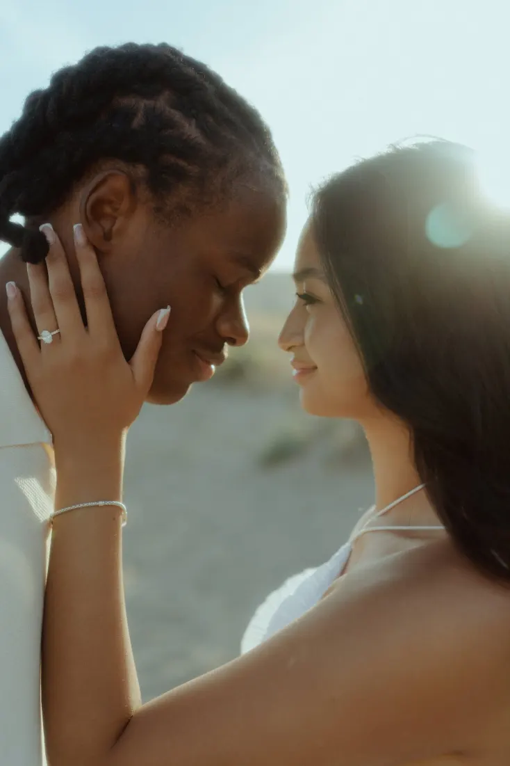 Dexter and Cheryl share an intimate portrait in golden light after their Castelldefels Beach proposal.