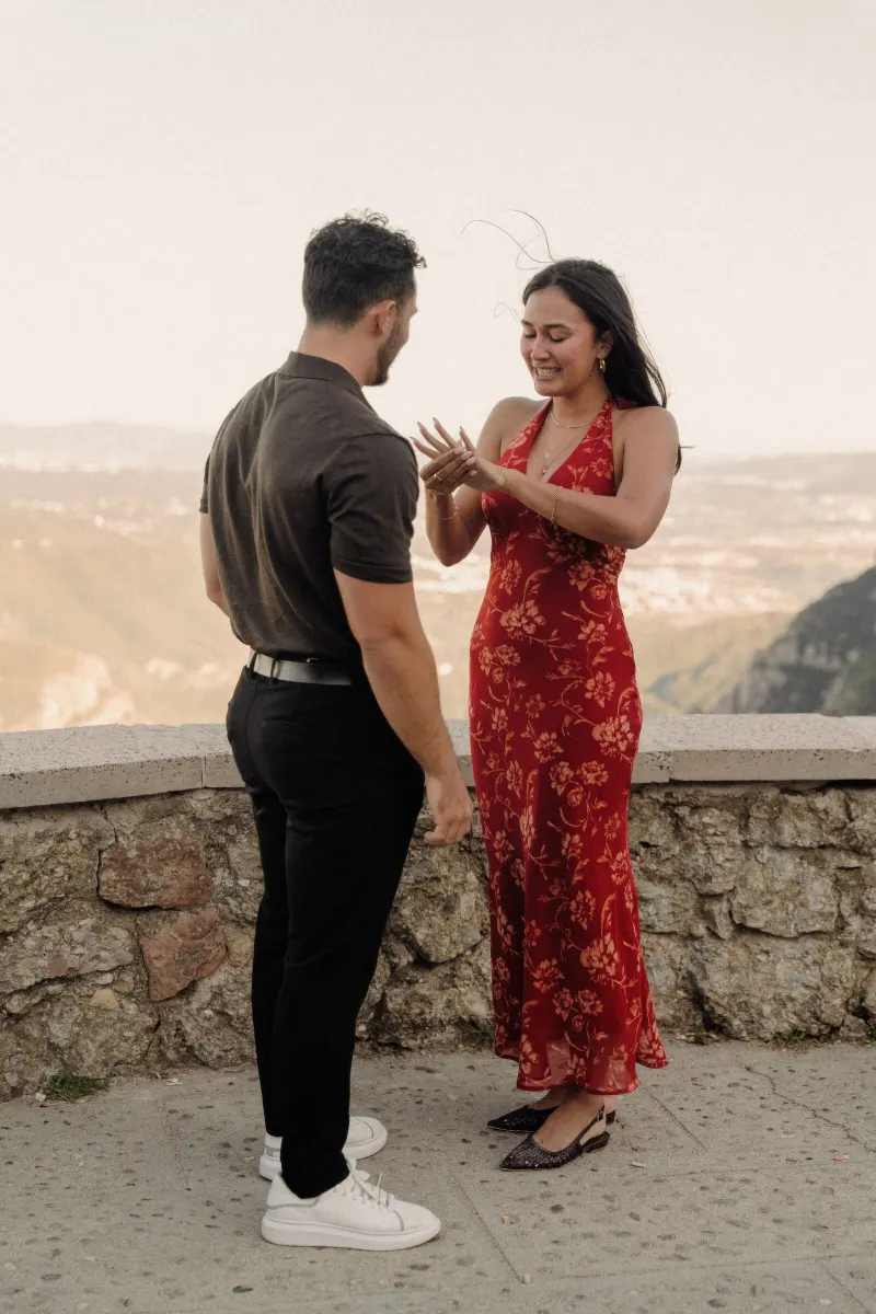 Sydney admires her new engagement ring during the first moments after Dan proposes.