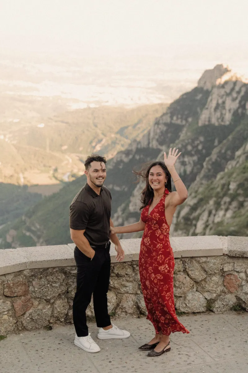 Sydney joyfully shows her engagement ring beside Dan at the Montserrat viewpoint.