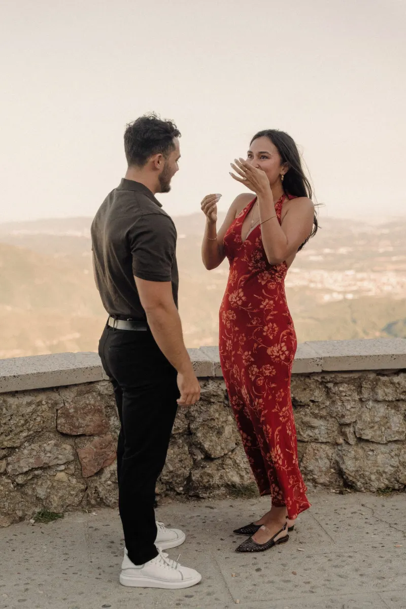 Sydney wipes away happy tears while Dan smiles after the proposal in Montserrat.