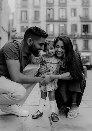 A joyful family shares a loving embrace with their daughter in the Born area, perfect for lifestyle photography sessions.