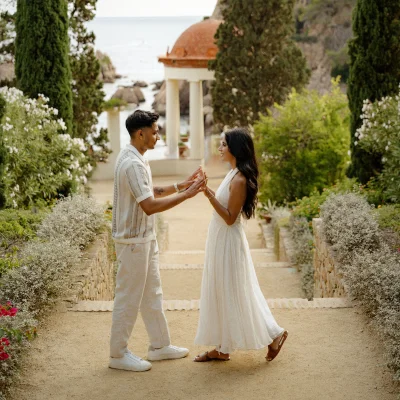Couple sharing a joyful moment in Marimurtra Garden, perfect for romantic or engagement photography in Barcelona.