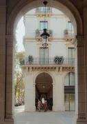 Couple walking hand in hand under elegant arches in Born, capturing candid moments for a lifestyle photography session.