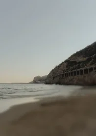 Soft evening light over Ginesta beach and port, perfect for serene couples or engagement photography sessions.