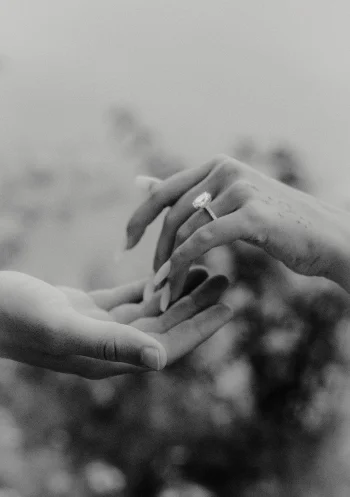 Close-up of a couple’s hands as she shows her engagement ring during a surprise proposal photoshoot in Barcelona.