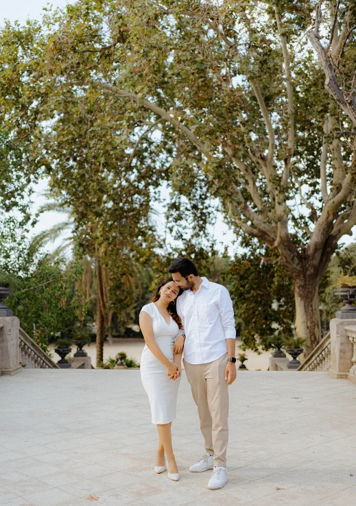 Engaged couple sharing a tender moment outdoors, perfect for a romantic engagement photography session.