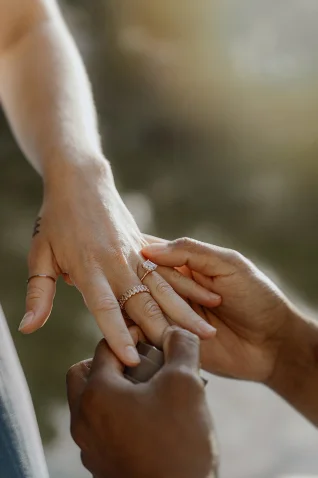 A heartfelt surprise proposal in Barcelona, capturing the moment a ring is placed on a loved one’s hand.