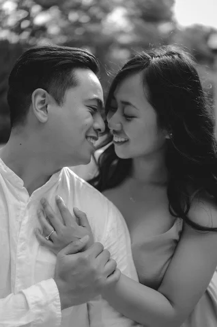 Engaged couple sharing a joyful, intimate moment during an engagement session in Barcelona.