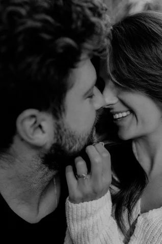 Engaged couple sharing a joyful, intimate moment in Barcelona, captured by a professional portrait photographer.