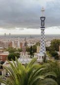 Park Güell’s mosaic towers rise above Barcelona, captured during a surprise proposal photoshoot at sunset.